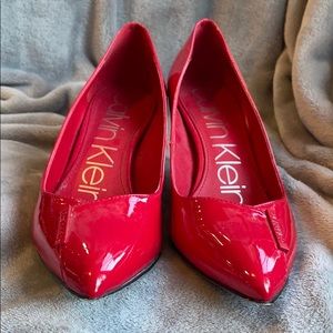 Red Calvin Klein pumps
